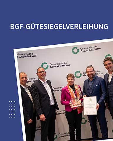 Auf dem Foto sieht man 5 Personen bei der Überreichung des BGF-Gütesiegels